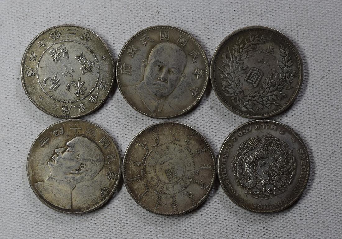 SIX CHINESE DOLLAR COINS: SIX CHINESE DOLLAR COINS. Each weight around 26.5 gram. Domestic shipping $5 and oversea $10. Combined shipping available. We accept pre-sale offer, phone bidding and post sale offer. For buyers from 