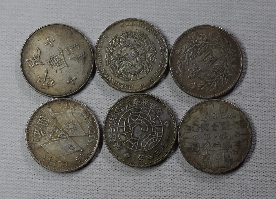 SIX CHINESE DOLLAR COINS: SIX CHINESE DOLLAR COINS. Each weight around 26.5 gram. Domestic shipping $5 and oversea $10. Combined shipping available. We accept pre-sale offer, phone bidding and post sale offer. For buyers from 