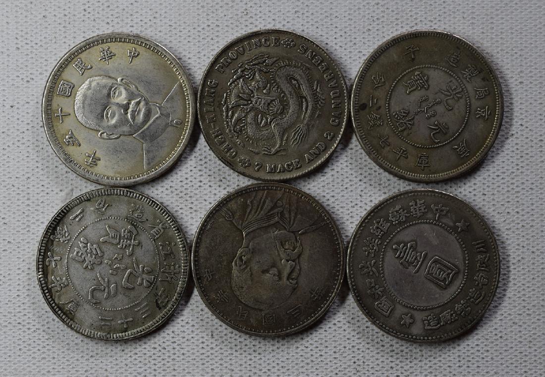SIX CHINESE DOLLAR COINS: SIX CHINESE DOLLAR COINS. Each weight around 26.5 gram. Domestic shipping $5 and oversea $10. Combined shipping available. We accept pre-sale offer, phone bidding and post sale offer. For buyers from 
