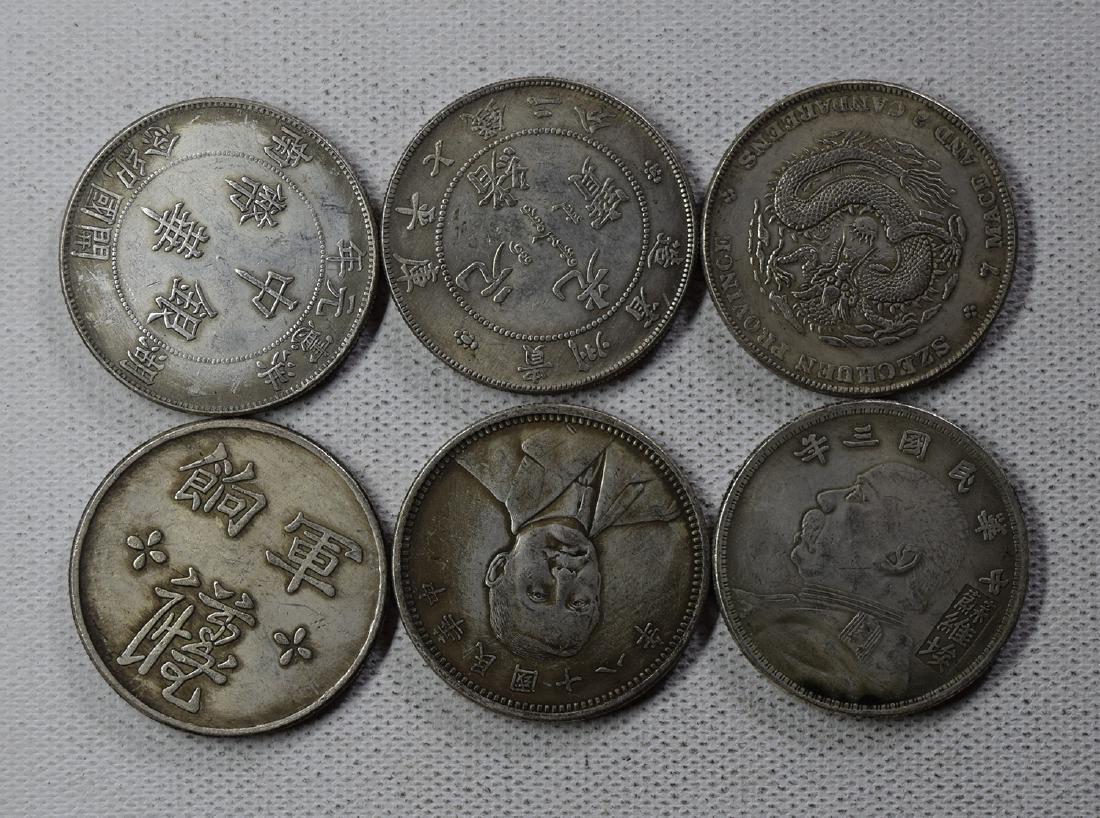 SIX CHINESE DOLLAR COINS: SIX CHINESE DOLLAR COINS. Each weight around 26.5 gram. Domestic shipping $5 and oversea $10. Combined shipping available. We accept pre-sale offer, phone bidding and post sale offer. For buyers from 