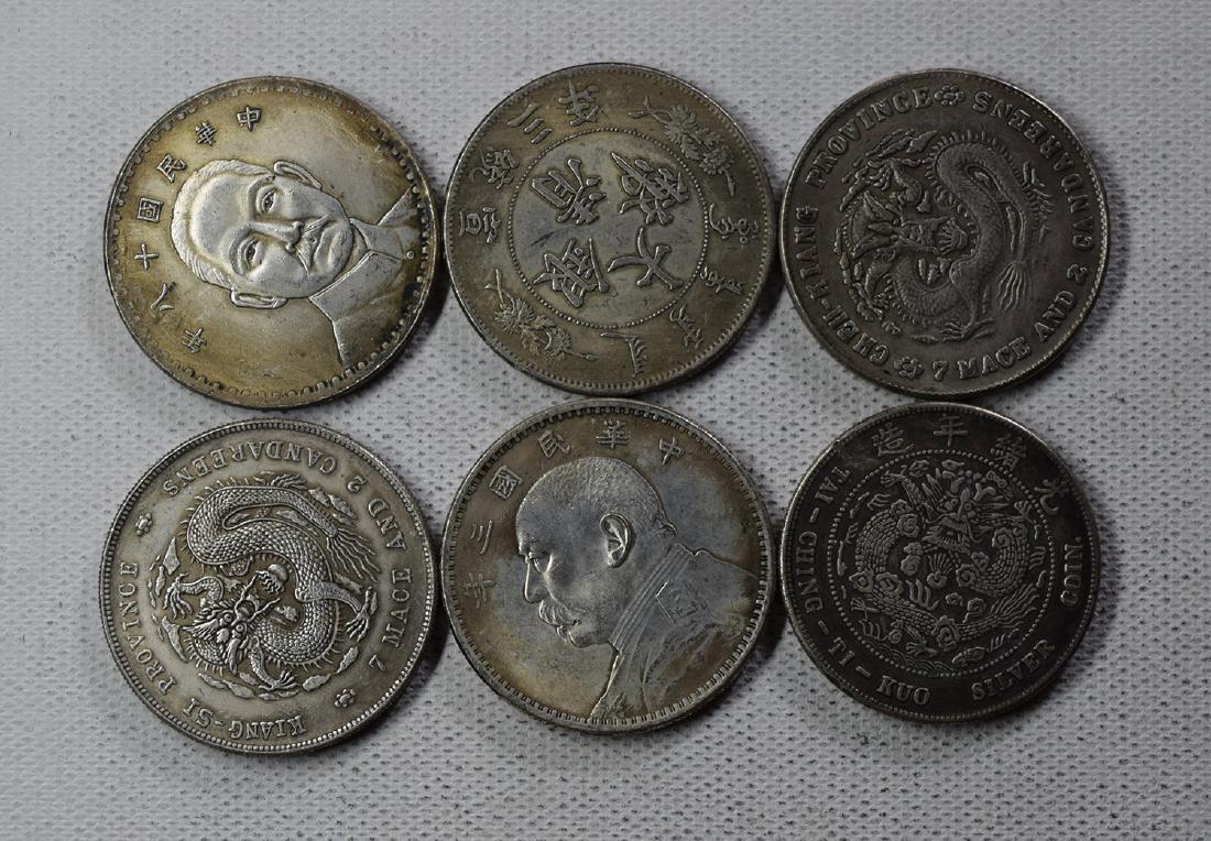 SIX CHINESE DOLLAR COINS: SIX CHINESE DOLLAR COINS. Each weight around 26.5 gram. Domestic shipping $5 and oversea $10. Combined shipping available. We accept pre-sale offer, phone bidding and post sale offer. For buyers from 