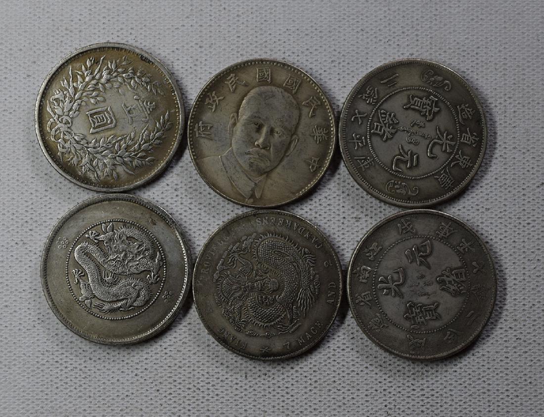 SIX CHINESE DOLLAR COINS: SIX CHINESE DOLLAR COINS. Each weight around 26.5 gram. Domestic shipping $5 and oversea $10. Combined shipping available. We accept pre-sale offer, phone bidding and post sale offer. For buyers from 