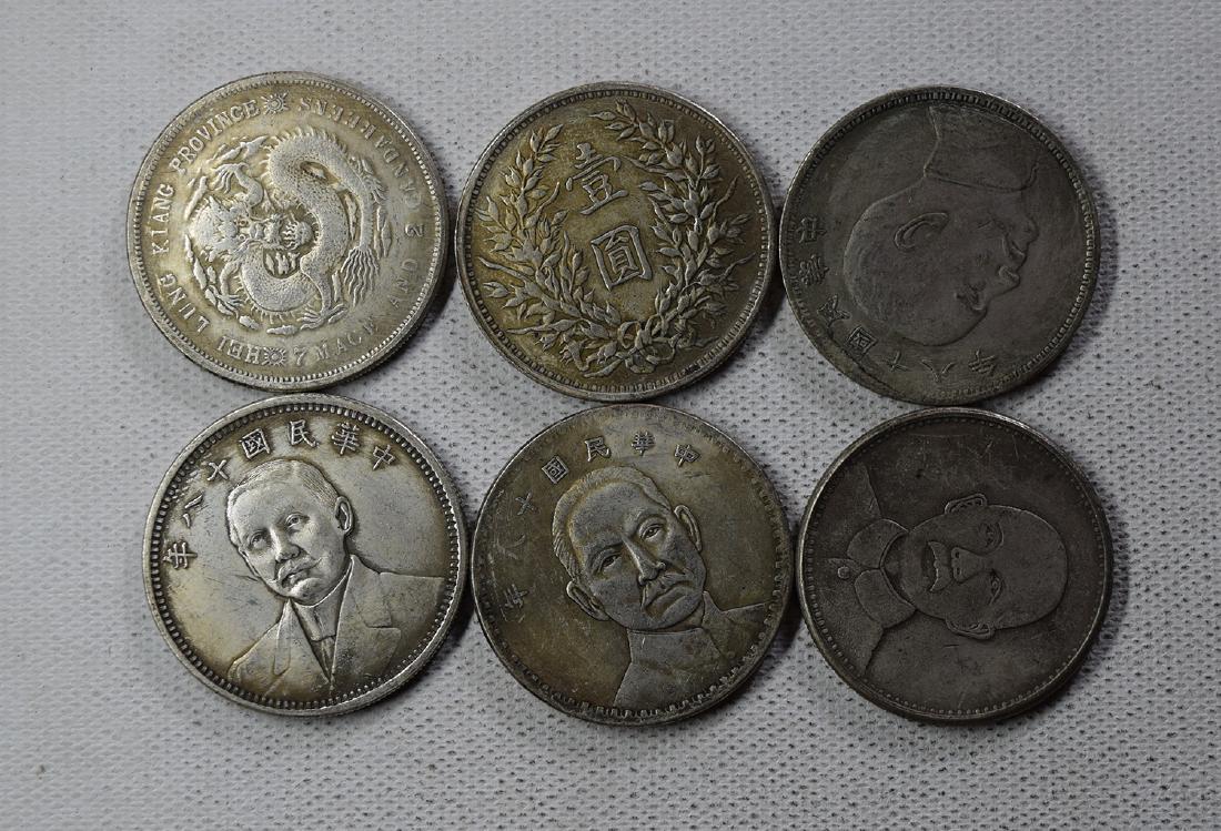 SIX CHINESE DOLLAR COINS: SIX CHINESE DOLLAR COINS. Each weight around 26.5 gram. Domestic shipping $5 and oversea $10. Combined shipping available. We accept pre-sale offer, phone bidding and post sale offer. For buyers from 