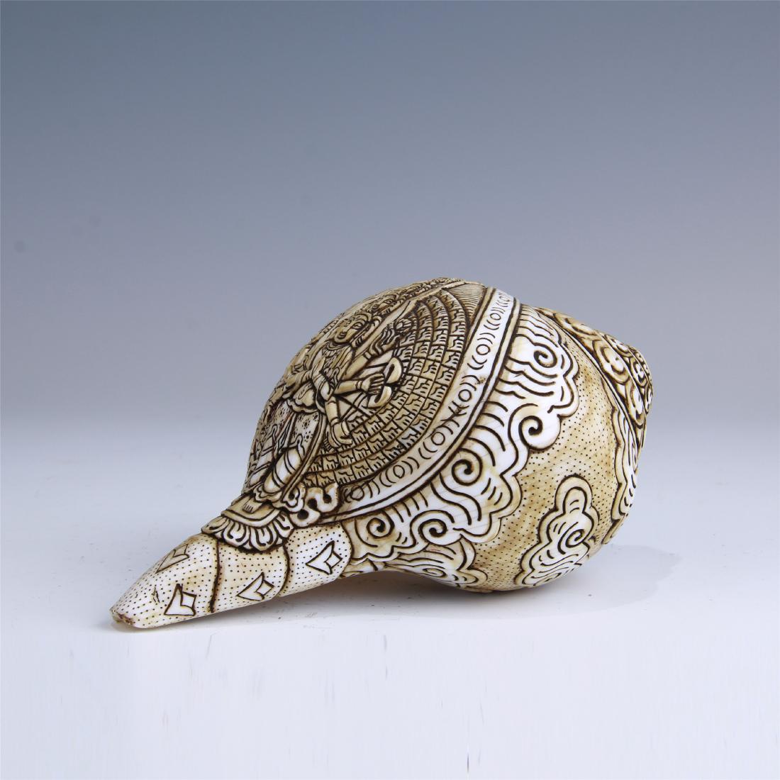 CHINESE BONE CARVED BUDDHIST CONCH: CHINESE BONE CARVED BUDDHIST CONCH. L. 18.5 cm. W. 11 cm. Domestic shipping $20 and oversea $60. Combined shipping available. Pick-up available in our NJ warehouse. We accept pre-sale offer, phone bid
