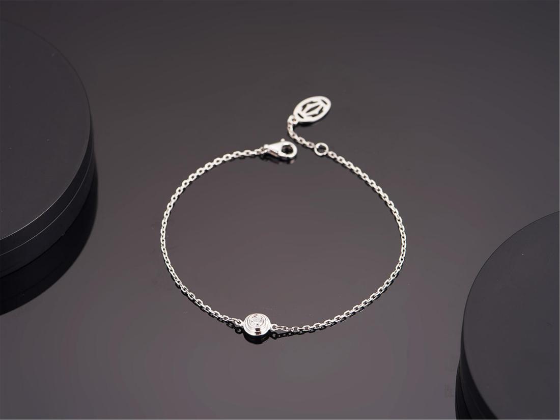 CARTIER 18K WHITE GOLD DIAMOND BRACELET: CARTIER 18K WHITE GOLD DIAMOND BRACELET. Weight 1.87 gram. Diamond 0.095 ct/1p. Free shipping. We accept pre-sale offer, phone bidding and post sale offer to save 5% Internet bidding fee. Note: We gur
