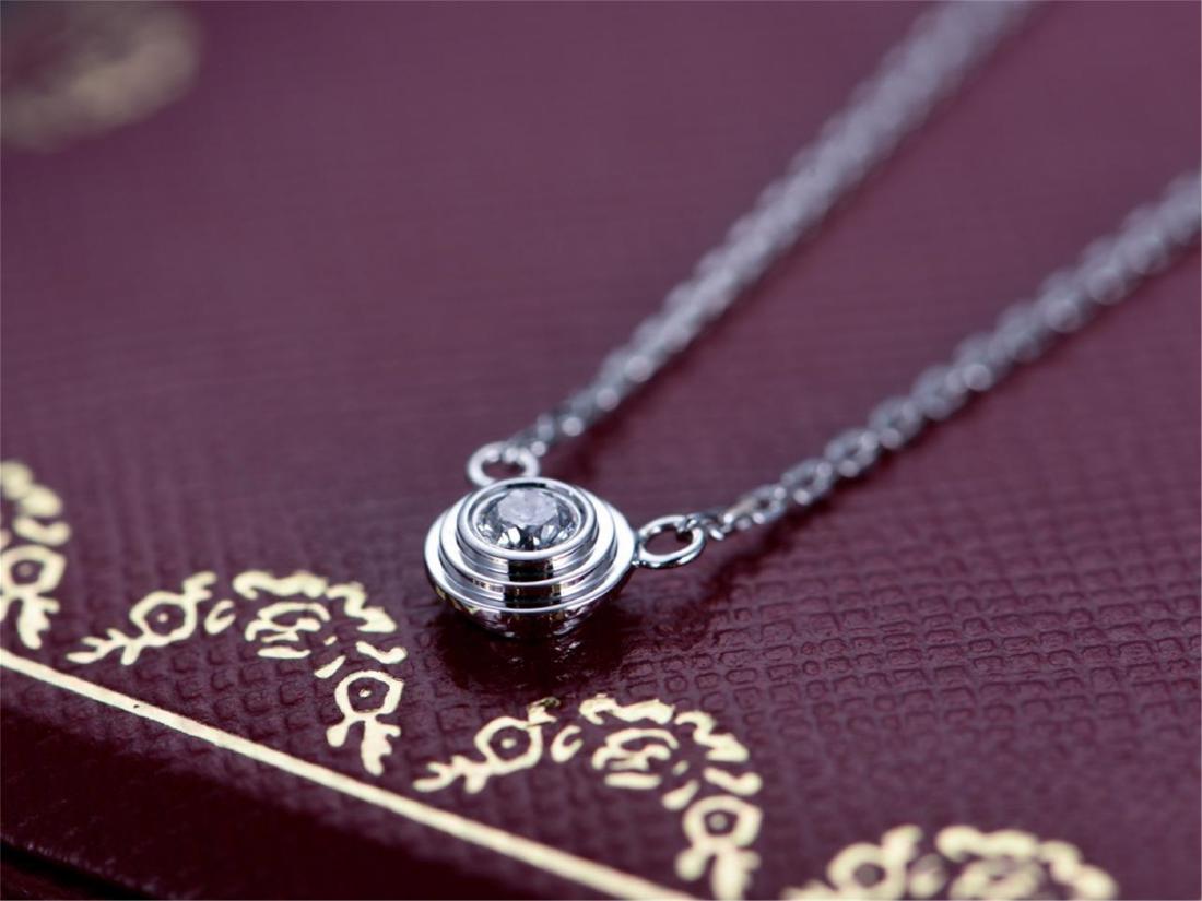 CARTIER 18K WHITE GOLD DIAMOND NECKLACE: CARTIER 18K WHITE GOLD DIAMOND NECKLACE. Weight 2.9 gram. Diamond 0.1 ct/1p. Free shipping. We accept pre-sale offer, phone bidding and post sale offer to save 5% Internet bidding fee. Note: We gurant