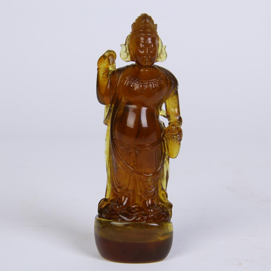CHINESE AMBER STANDING GUANYIN WITH BASE: CHINESE AMBER STANDING GUANYIN WITH BASE. H. 9.5 cm. L. 3.5 cm. W. 2.5 cm. Weight 31 gram. Domestic shipping $20 and oversea $60. Combined shipping available. Pick-up available in our NJ warehouse. We