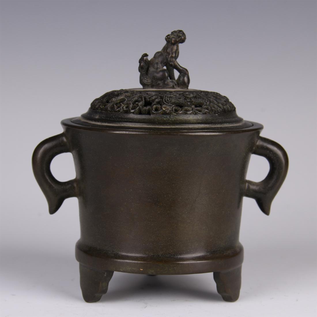 CHINESE BRONZE LIDDED TRIPLE FEET CYLINDERIAL CENSER: CHINESE BRONZE LIDDED TRIPLE FEET CYLINDERIAL CENSER. H. 17 cm. L. 15 cm. W. 12 cm. Weight 1739 gram.Domestic shipping $20 and oversea $60. Combined shipping available. Pick-up available in our NJ war