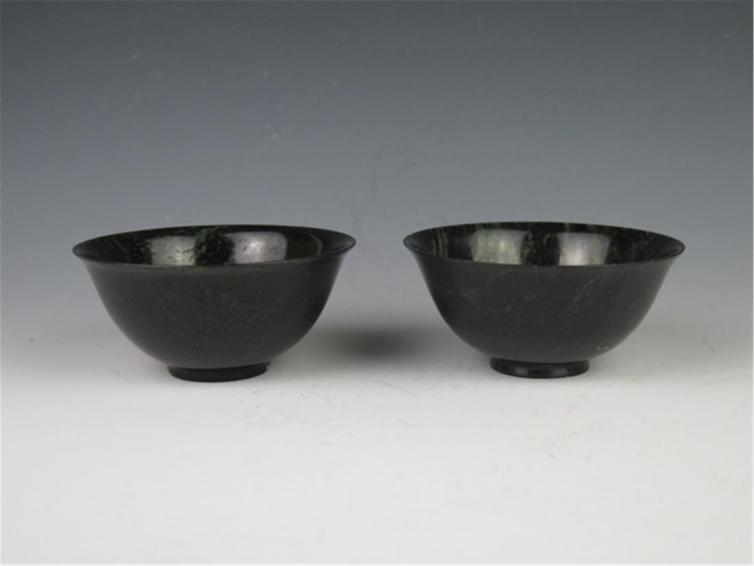 PAIR OF CHINESE INK JADE BOWLS: PAIR OF CHINESE INK JADE BOWLS. H. 6 cm. Diam. 12 cm. Domestic shipping $20 and oversea $60. Combined shipping available. Pick-up available in our NJ warehouse. We accept pre-sale offer, phone bidding