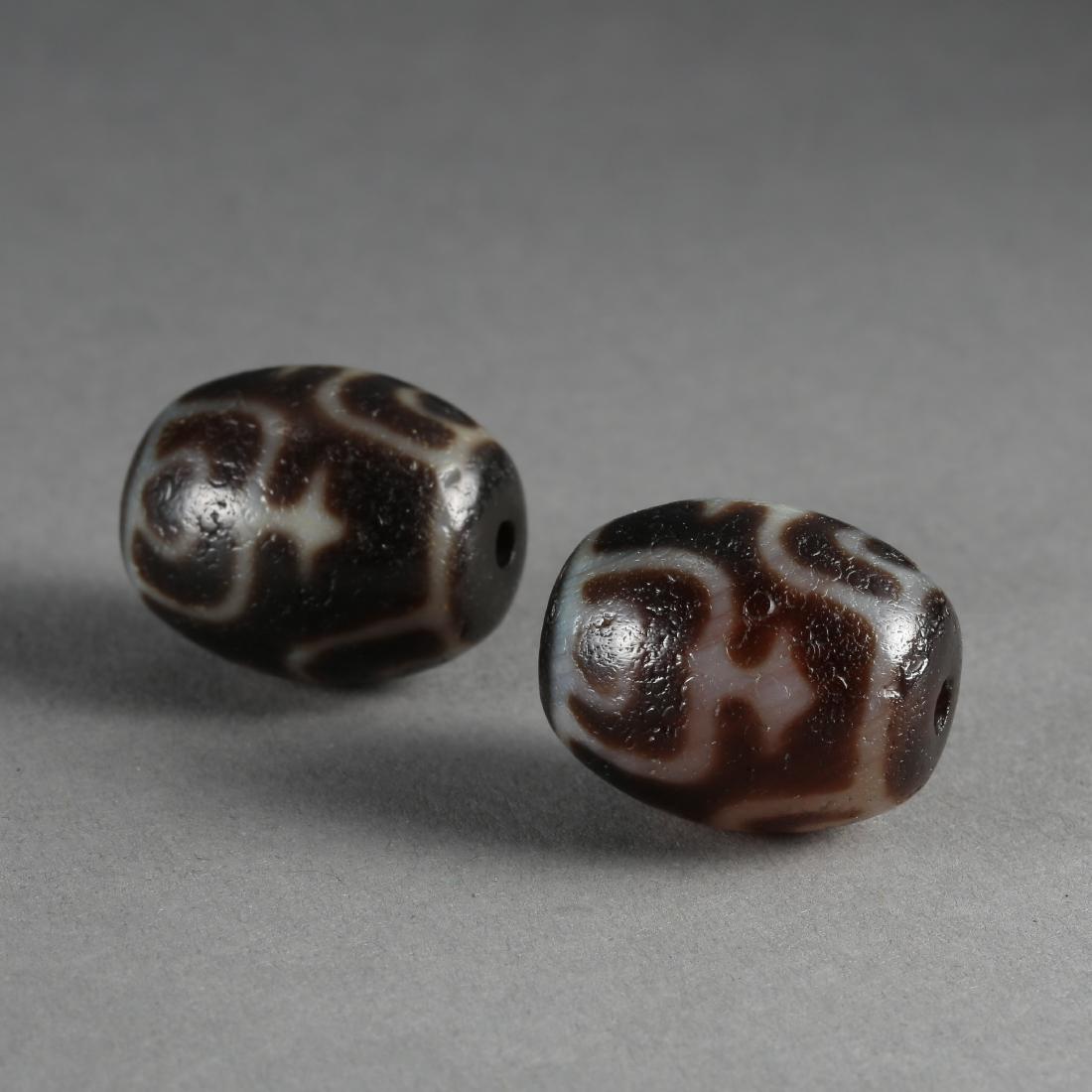TWO TIBETAN DZI BEADS (1 of 7)