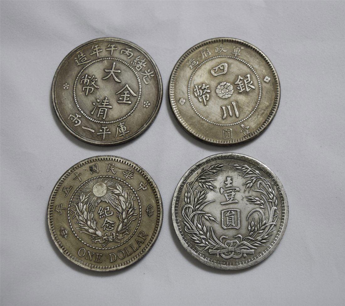 FOUR CHINESE SILVER DOLLAR COINS (1 of 3)