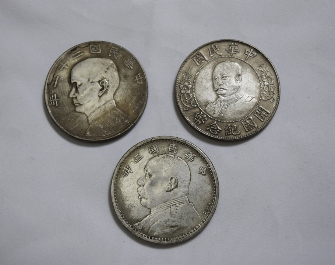 THREE CHINESE SILVER DOLLAR COINS (1 of 3)