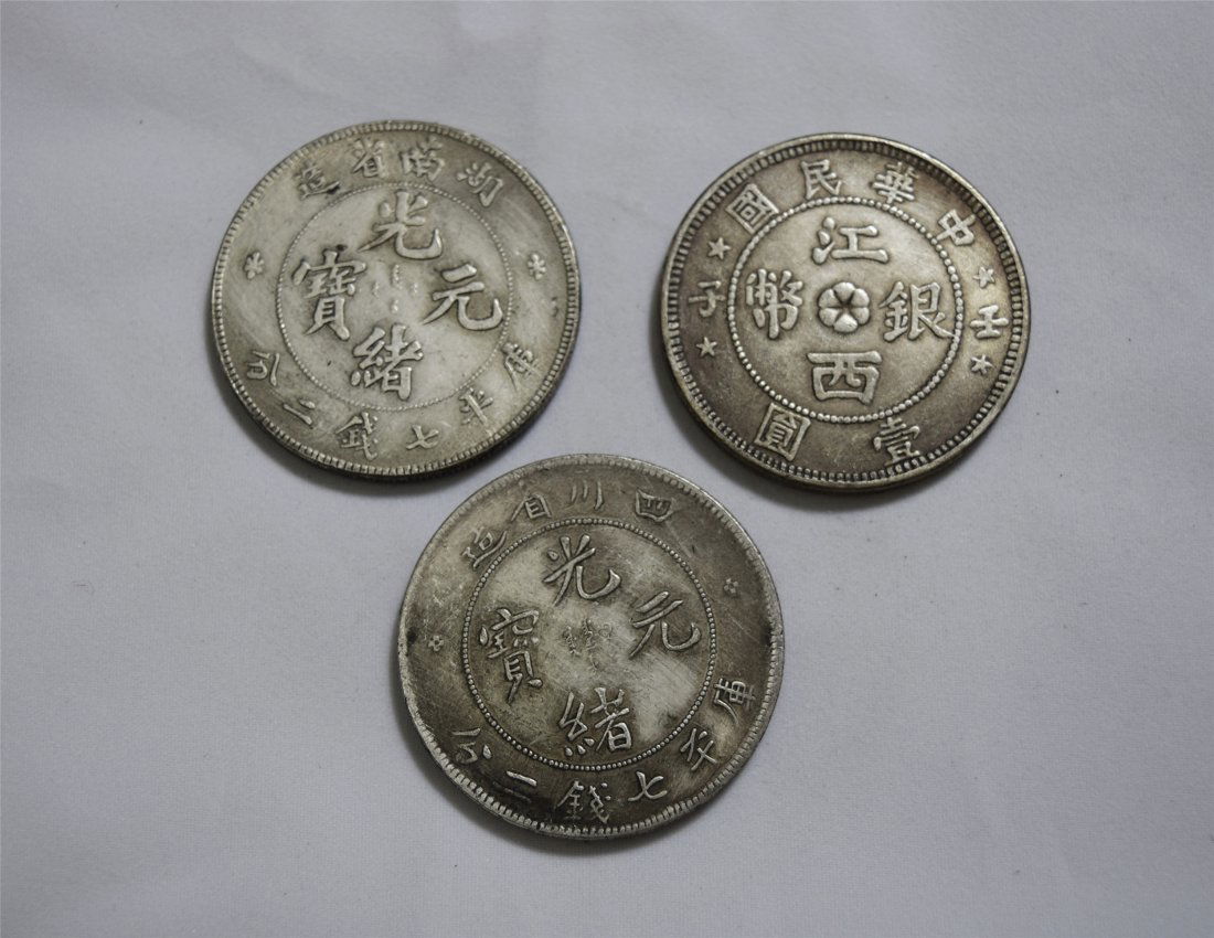 THREE CHINESE SILVER DOLLAR COINS (1 of 3)