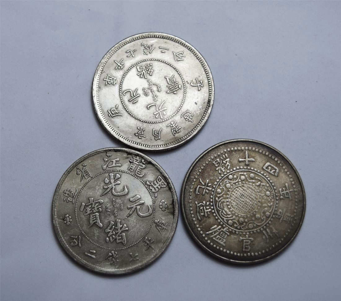 THREE CHINESE SILVER DOLLAR COINS (1 of 3)