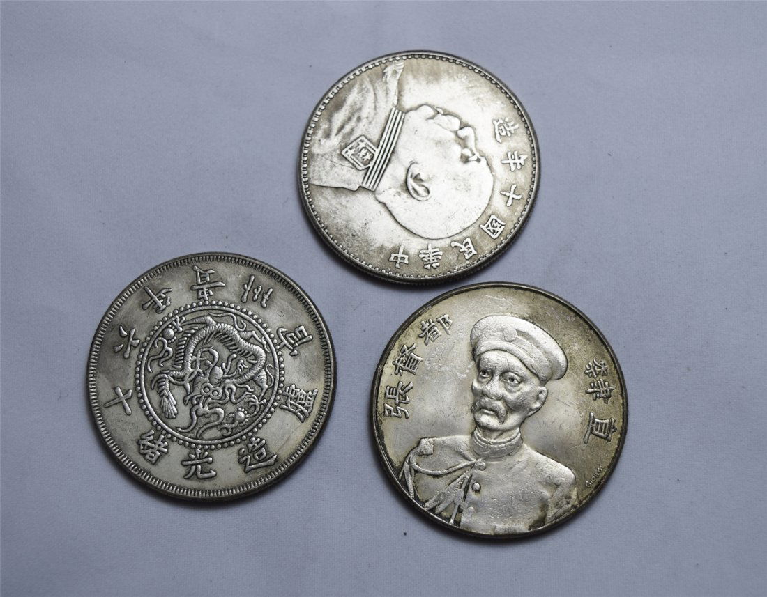 THREE CHINESE SILVER DOLLAR COINS (1 of 3)