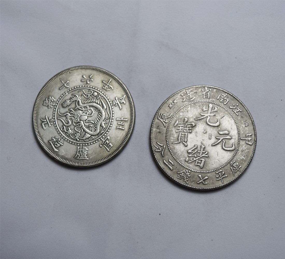 TWO CHINESE SILVER DOLLAR COINS (1 of 3)