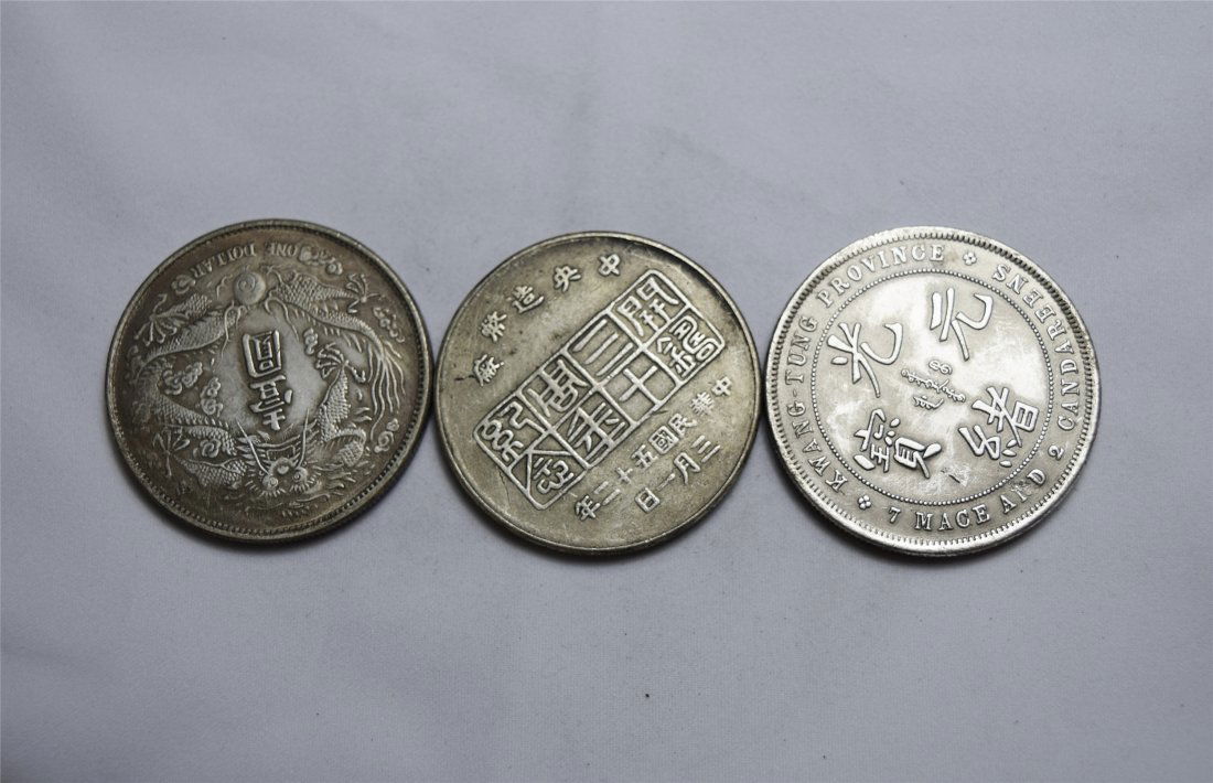 THREE CHINESE SILVER DOLLAR COINS (1 of 3)