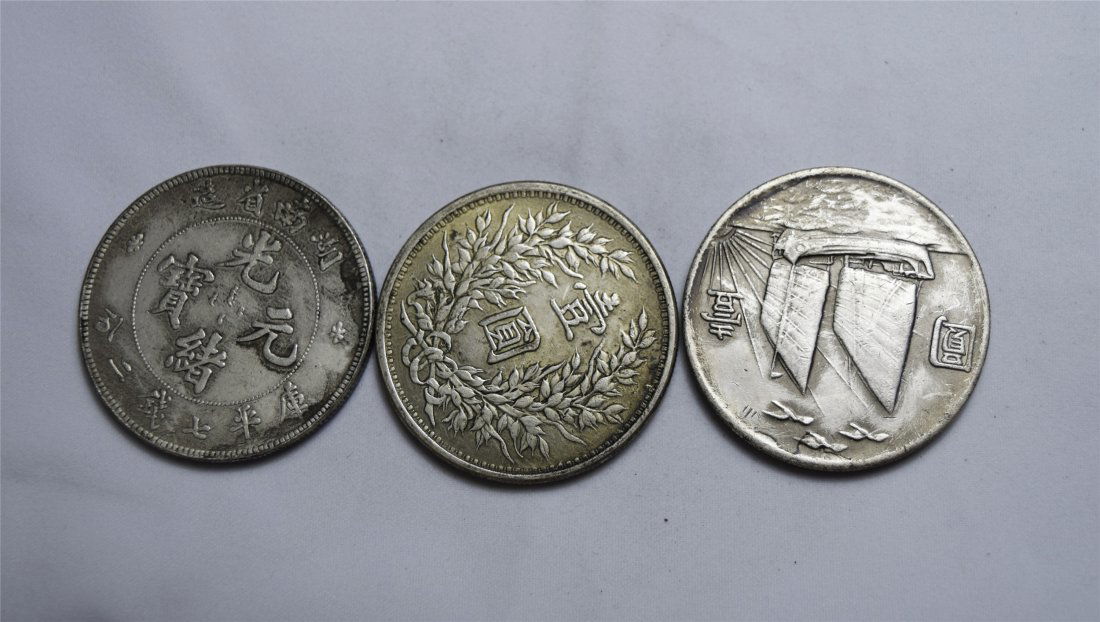 THREE CHINESE SILVER DOLLAR COINS (1 of 3)