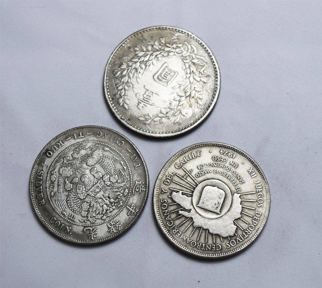 THREE CHINESE SILVER DOLLAR COINS (1 of 3)