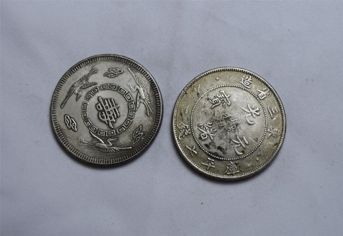 TWO CHINESE SILVER DOLLAR COINS (1 of 3)