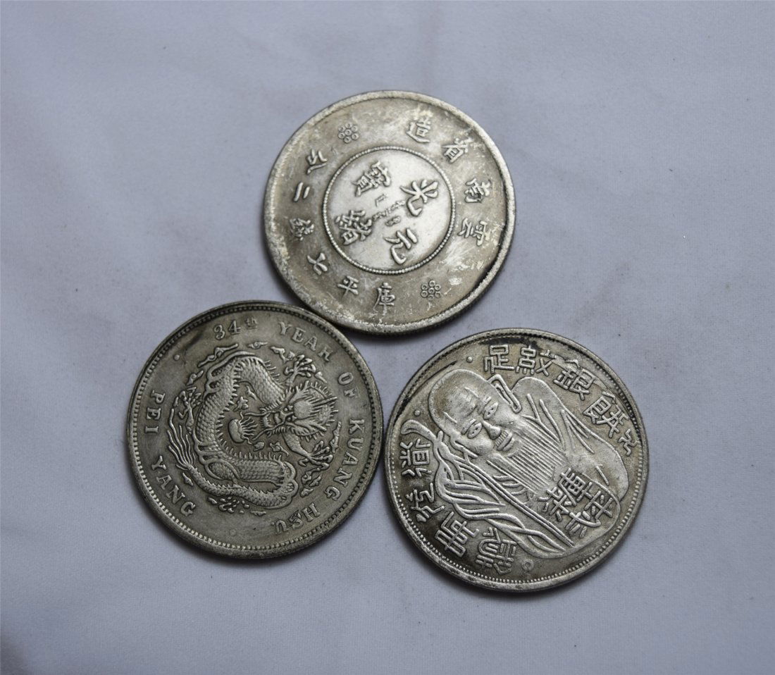 THREE CHINESE SILVER DOLLAR COINS (1 of 3)
