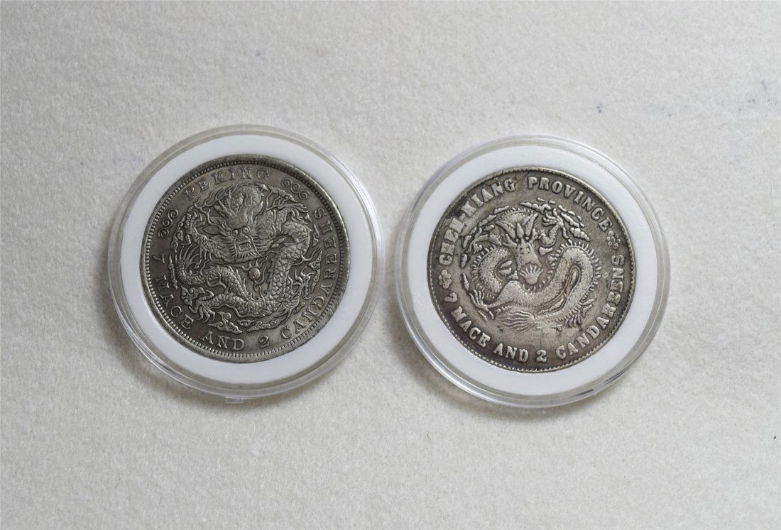 TWO CHINESE DOLLAR SILVER COINS (1 of 2)
