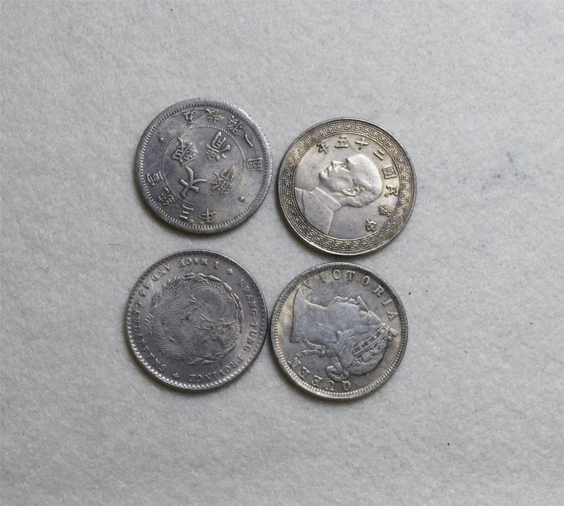 FOUR CHINESE SILVER COINS (1 of 2)
