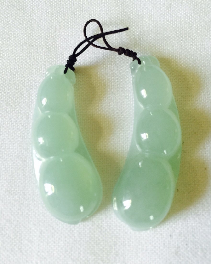 TWO NATURAL JADEITE BEAN PENDANTS (1 of 2)