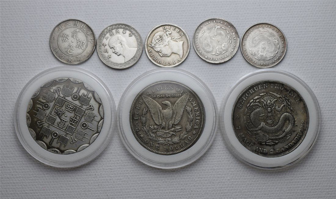 EIGHT CHINESE SILVER COINS (1 of 2)