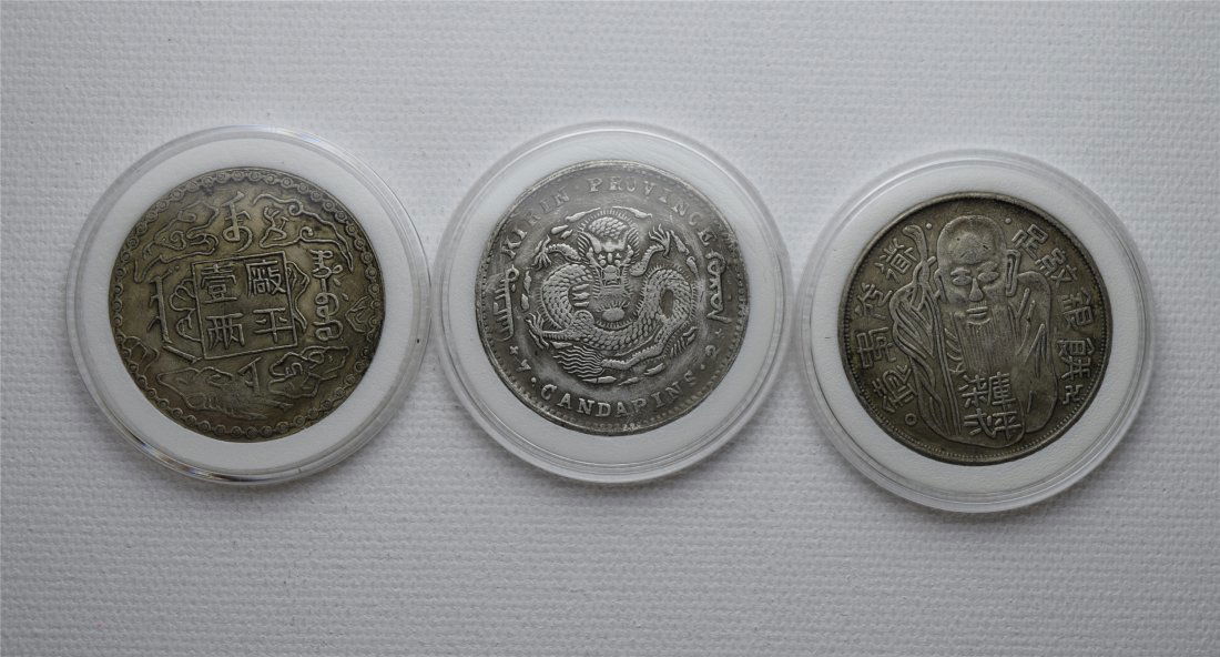 THREE CHINESE DOLLAR SILVER COINS (1 of 2)