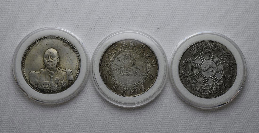 THREE CHINESE SILVER DOLLAR COINS (1 of 2)