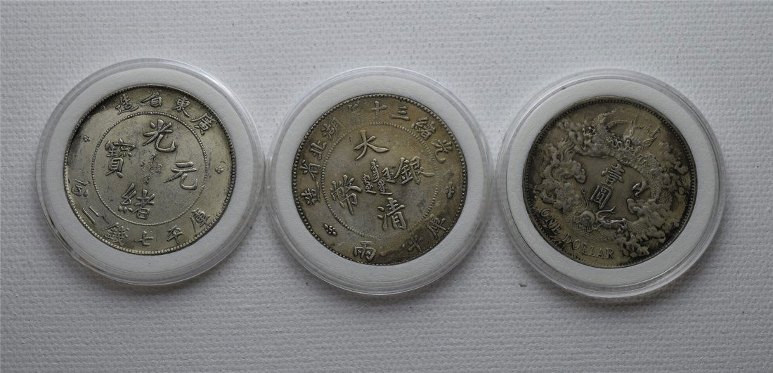 THREE CHINESE SILVER DOLLAR COINS (1 of 2)