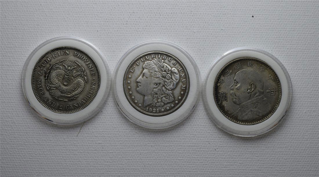 THREE CHINESE SILVER DOLLAR COINS (1 of 2)