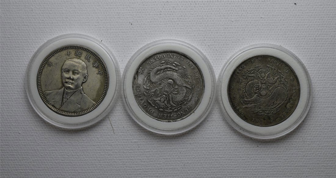 THREE CHINESE SILVER DOLLAR COINS (1 of 2)