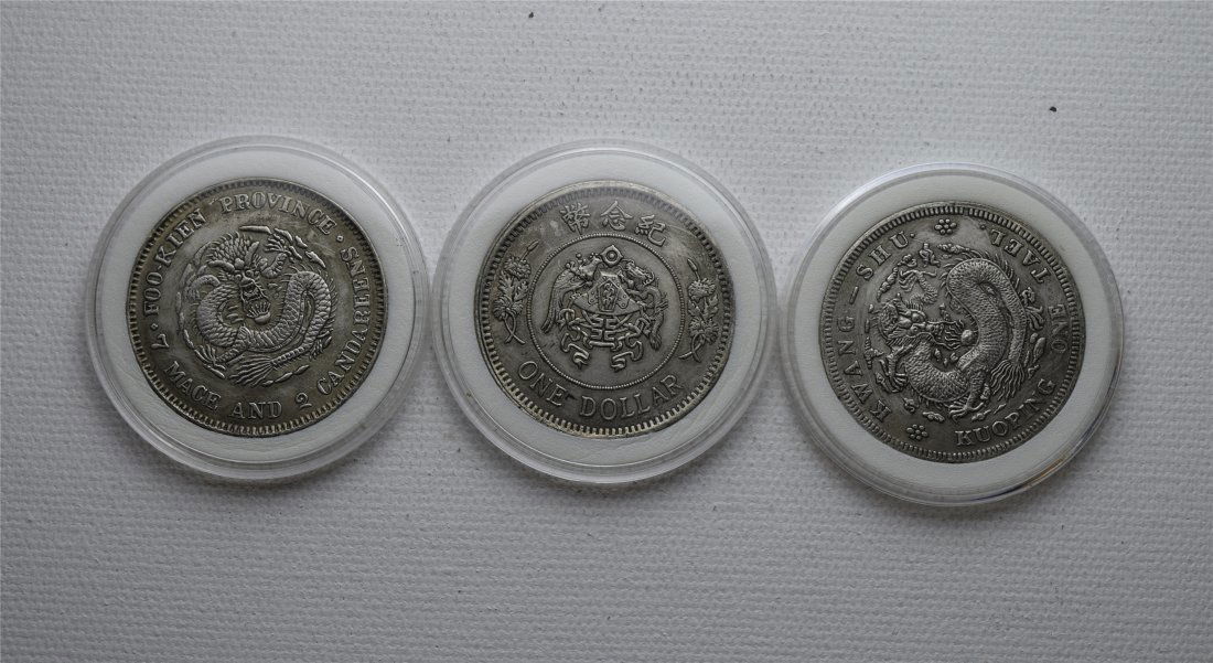 THREE CHINESE SILVER DOLLAR COINS (1 of 2)