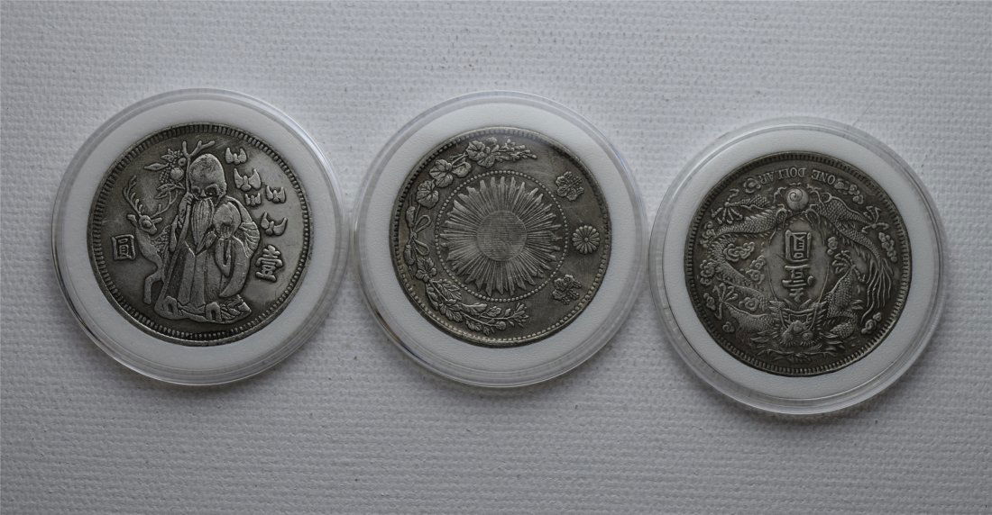 THREE CHINESE SILVER DOLLAR COINS (1 of 2)