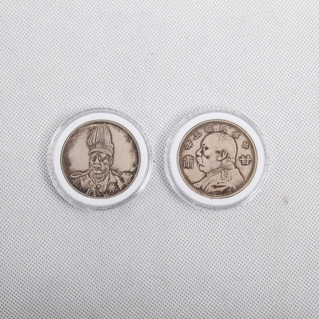 TWO CHINESE SILVER DOLLAR COINS (1 of 2)