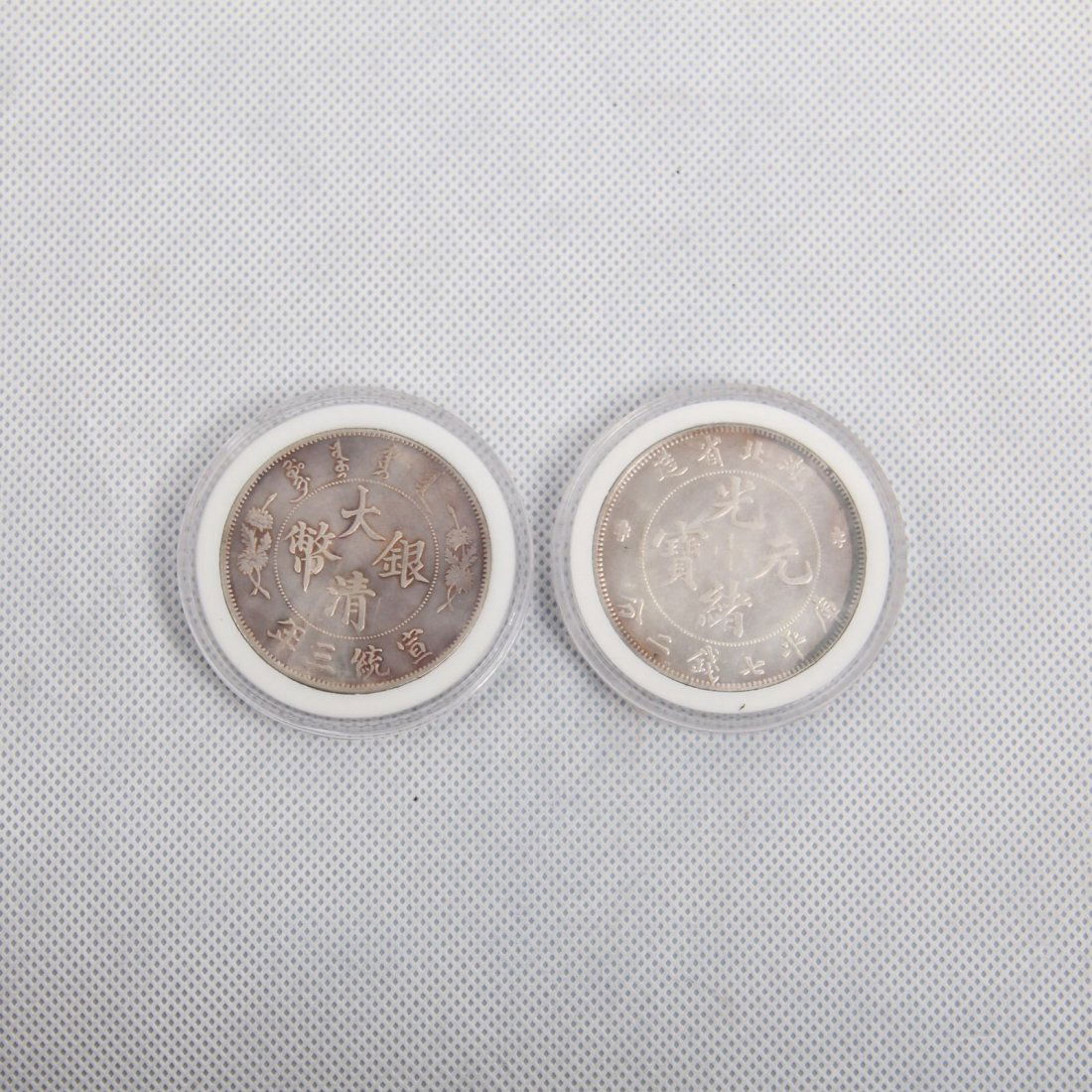 TWO CHINESE SILVER DOLLAR COINS (1 of 2)