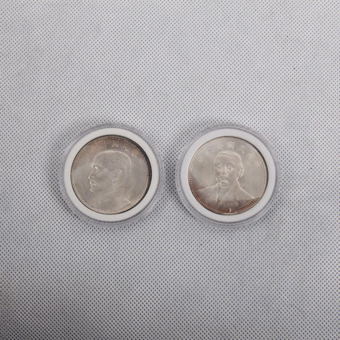 TWO CHINESE SILVER DOLLAR COINS (1 of 2)