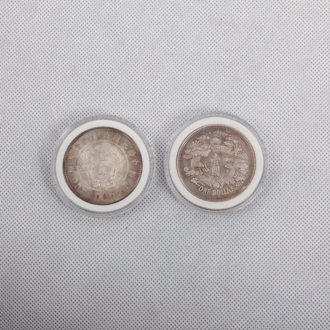 TWO CHINESE SILVER DOLLAR COINS (1 of 2)
