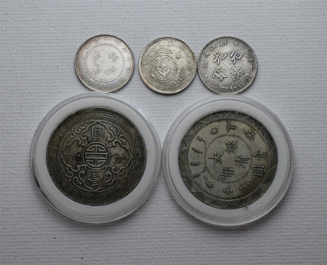 FIVE CHINESE SILVER COINS (1 of 2)