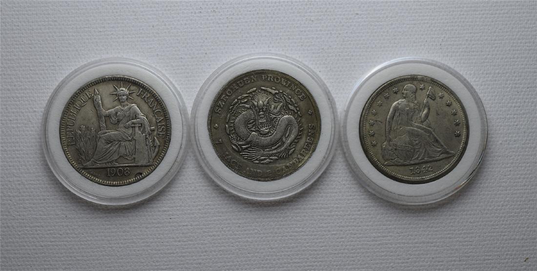 THREE CHINESE SILVER DOLLAR COINS (1 of 2)
