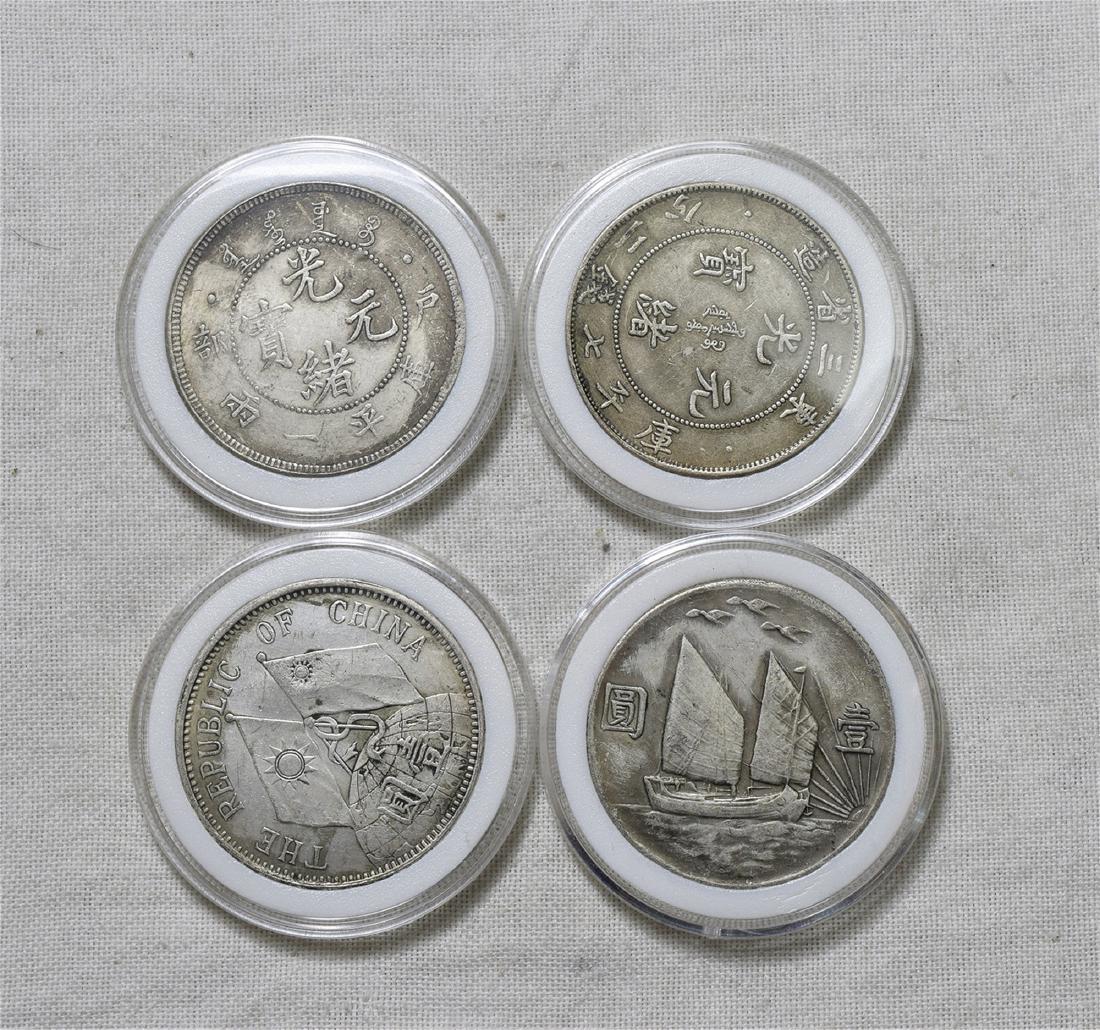 FOUR CHINESE SILVER DOLLAR COINS (1 of 2)