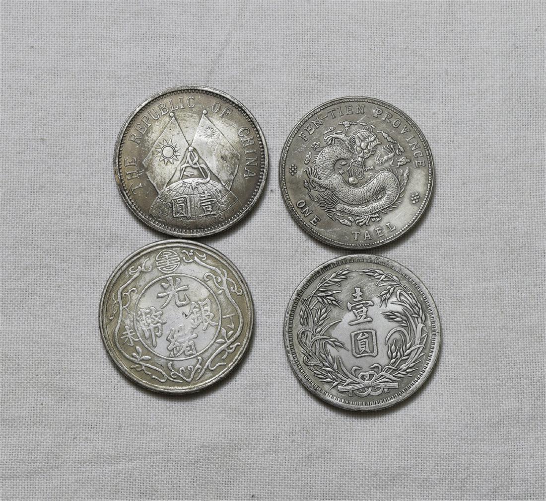 FOUR CHINESE SILVER DOLLAR COINS (1 of 2)