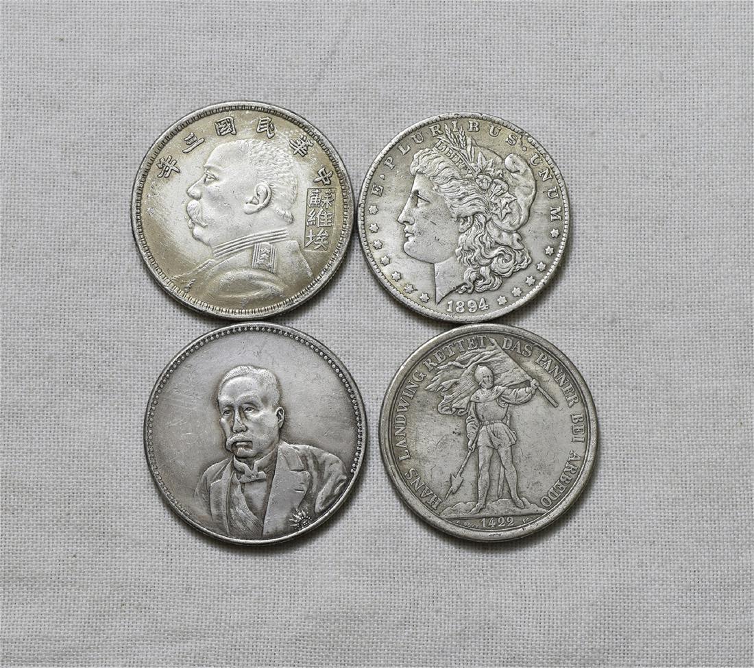 FOUR CHINESE SILVER DOLLAR COINS (1 of 2)