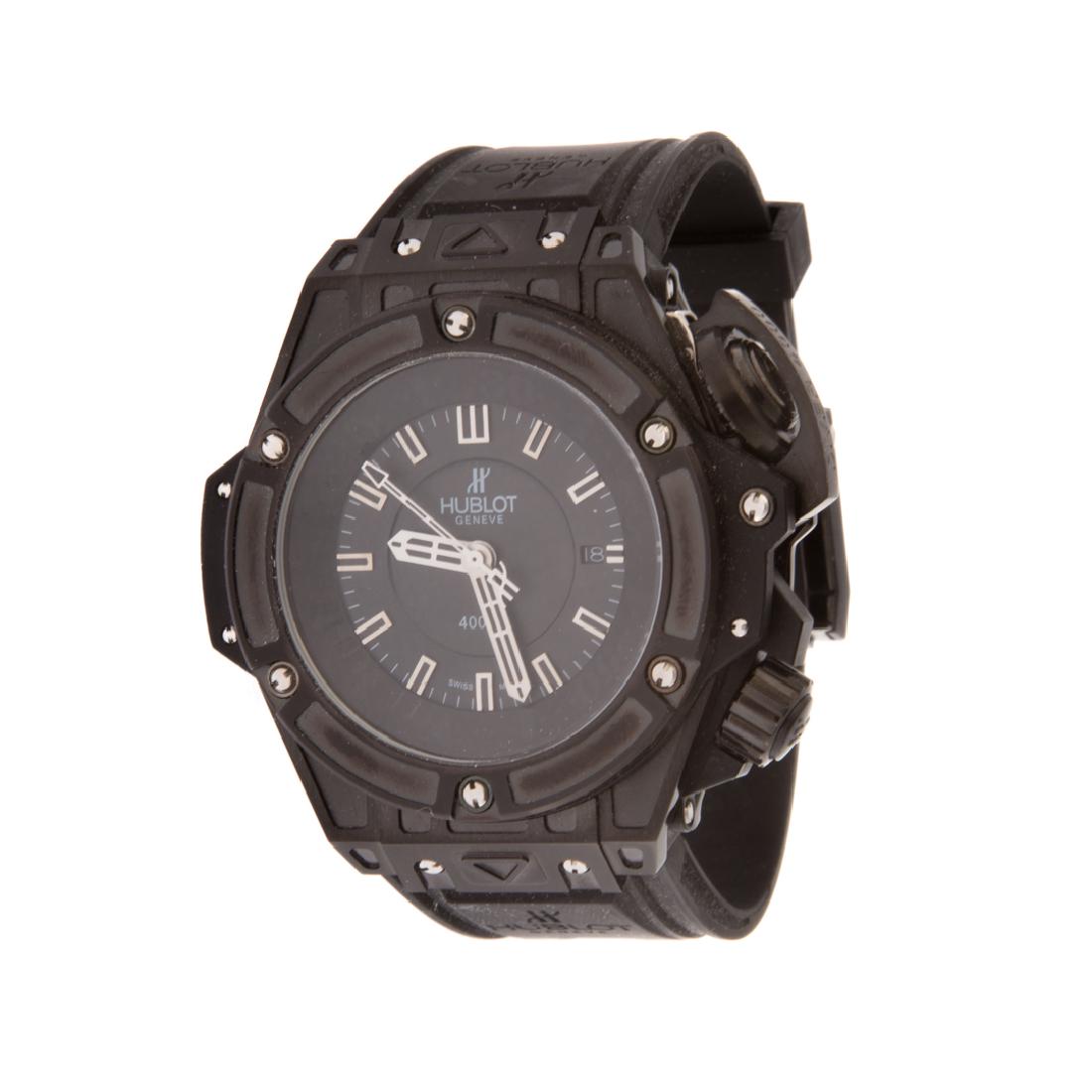A Gent's Hublot Inspired Diver 4000 Watch: Blackened stainless steel dial, black face, dashes for numbers, rubber strap, mechanical movement, 171 grams