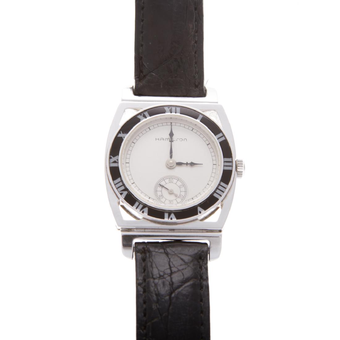 A Hamilton 1928 Yankees World Champion Watch: Stainless steel Hamilton wrist watch, white face with black enamel border, mechanical movement, back engraved with "1928 New York Yankees World Champions" black strap