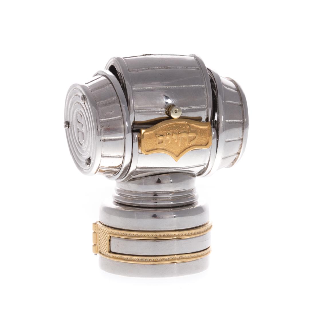 A Designer Sterling & Gold Wine Stopper: Sterling silver with 14K yellow gold detailing, from Swed Masters Workshop marked "R H Israel", 21/500, Cork Scales of Justice, in original packaging, 2.75 in. L, 173 grams tw