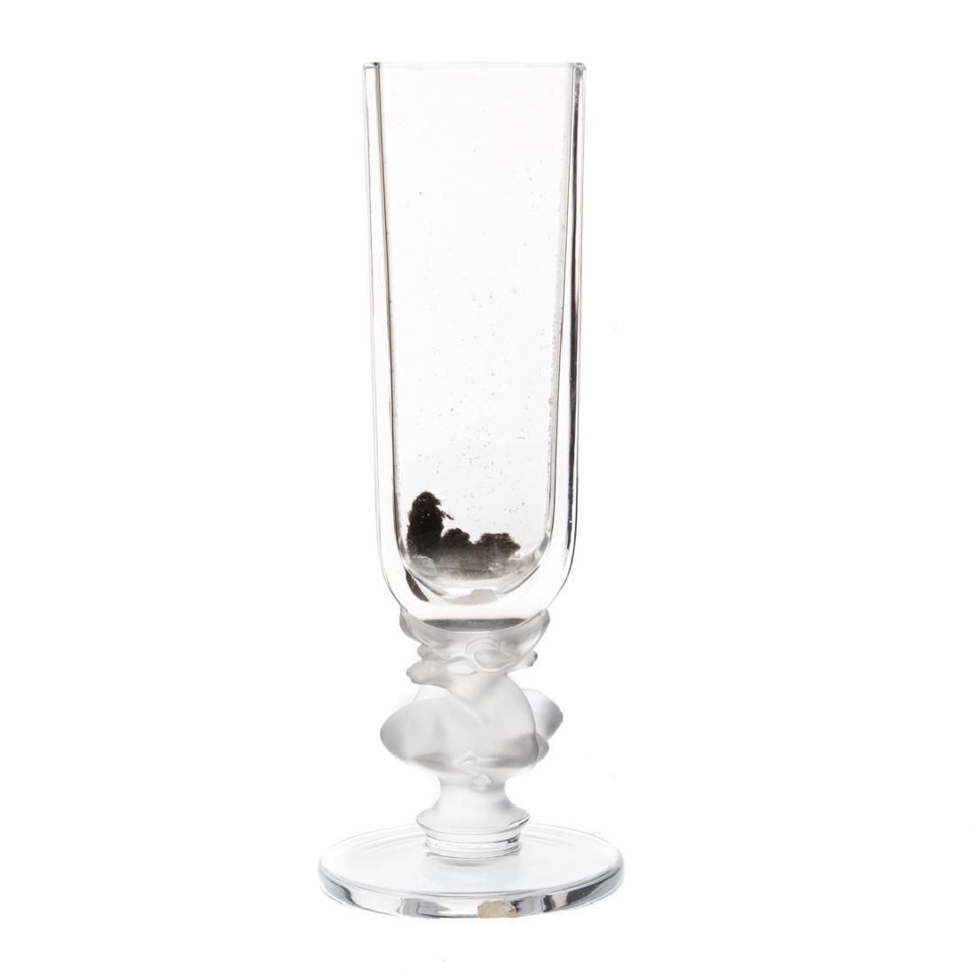 Lalique crystal vase: circular foot with two intertwined reclining deer supporting rectangular paneled vase, inscribed "Lalique, France," 11 1/2 in. H. Condition: Interior has remnants from use, scratches underneath foot