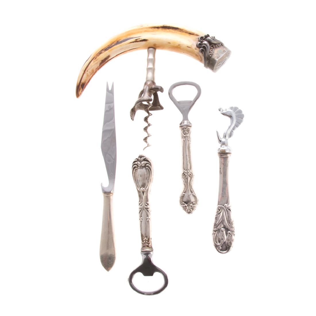 A collection of sterling bar tools 5 items: 1) boar tooth cork screw with sterling terminal, monogrammed "N" "1905", 2) Danish sterling handled bottle opener by Axel Prip, Copenhagen, 2 other bottle openers, and a bar knife with sterling handle